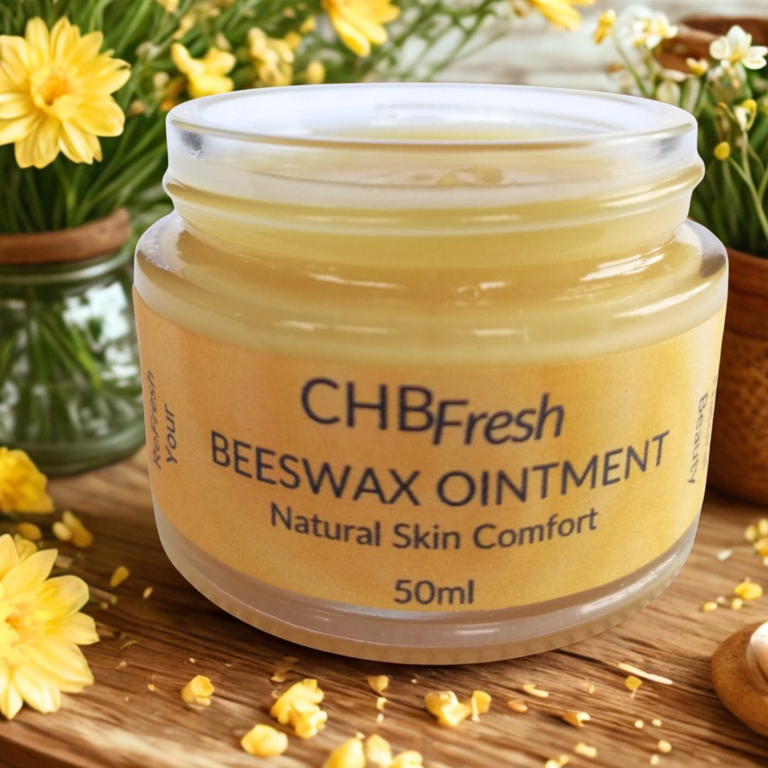 Beeswax ointment on wooden table with beeswax shavings and yellow flowers