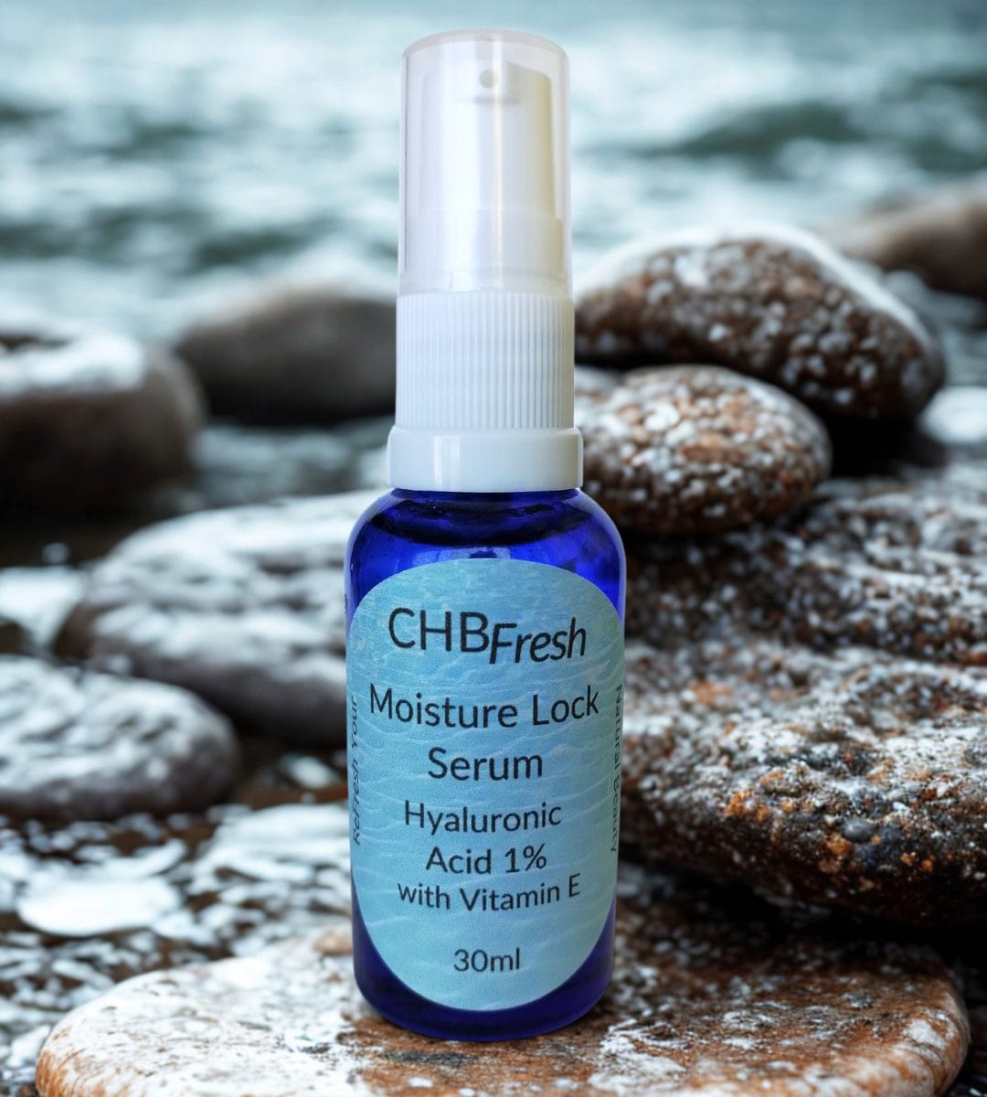 Moisturelock Serum on rocks by the sea